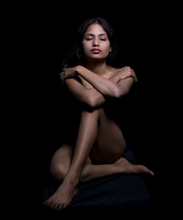 Seated with crossed arms