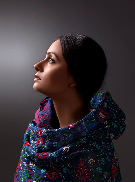 Profile in embroidered kantha shawl