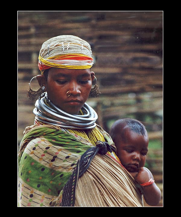 Bonda tribal mother with sleeping child
