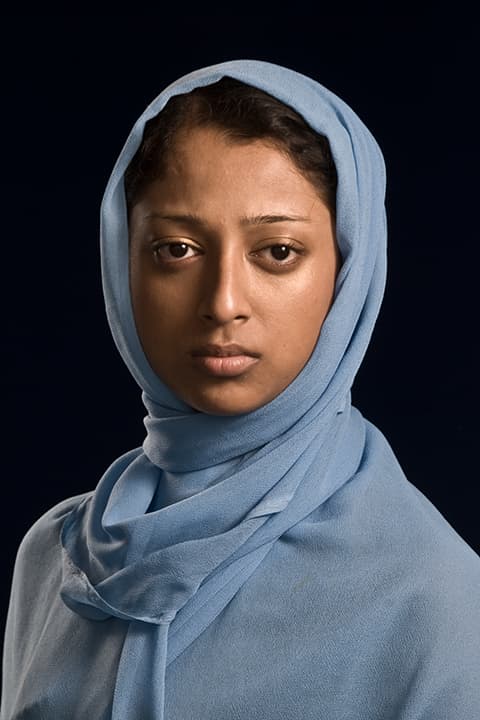 Young woman in powder-blue scarf