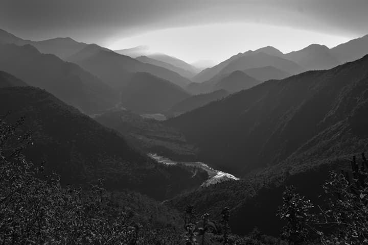 Layered Himalayan ridges with river valley