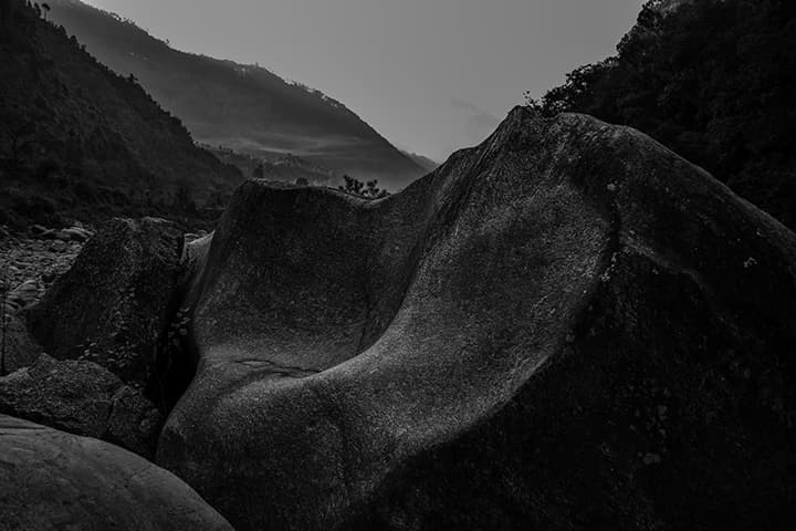Sculpted river boulder at dusk