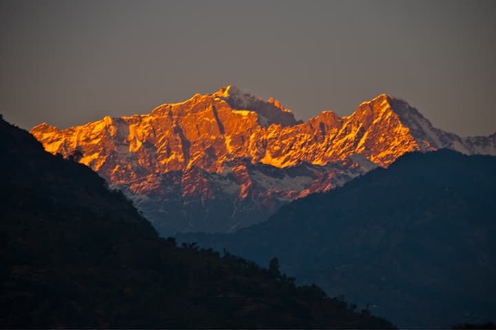 Alpenglow on snow peaks